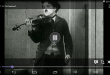 Watch torrent movies streaming (w/o complete download) on Android A screenshot of Charlie Chaplin playing violin on the movie Vagabond from the year 1916